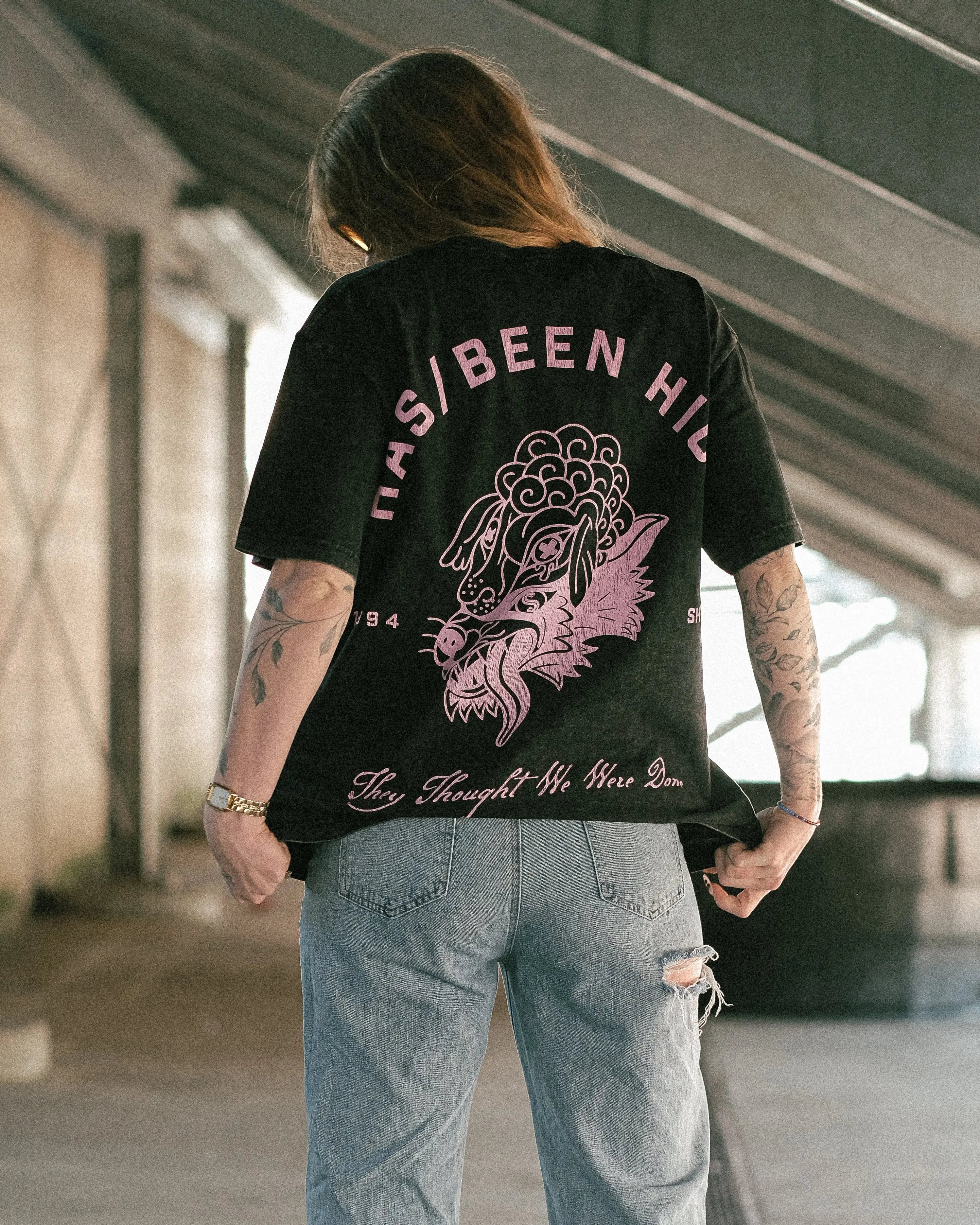 HAS/BEEN HIGH 1994 oversized graphic tee black vintage wash back print on model angled view streetwear outfit