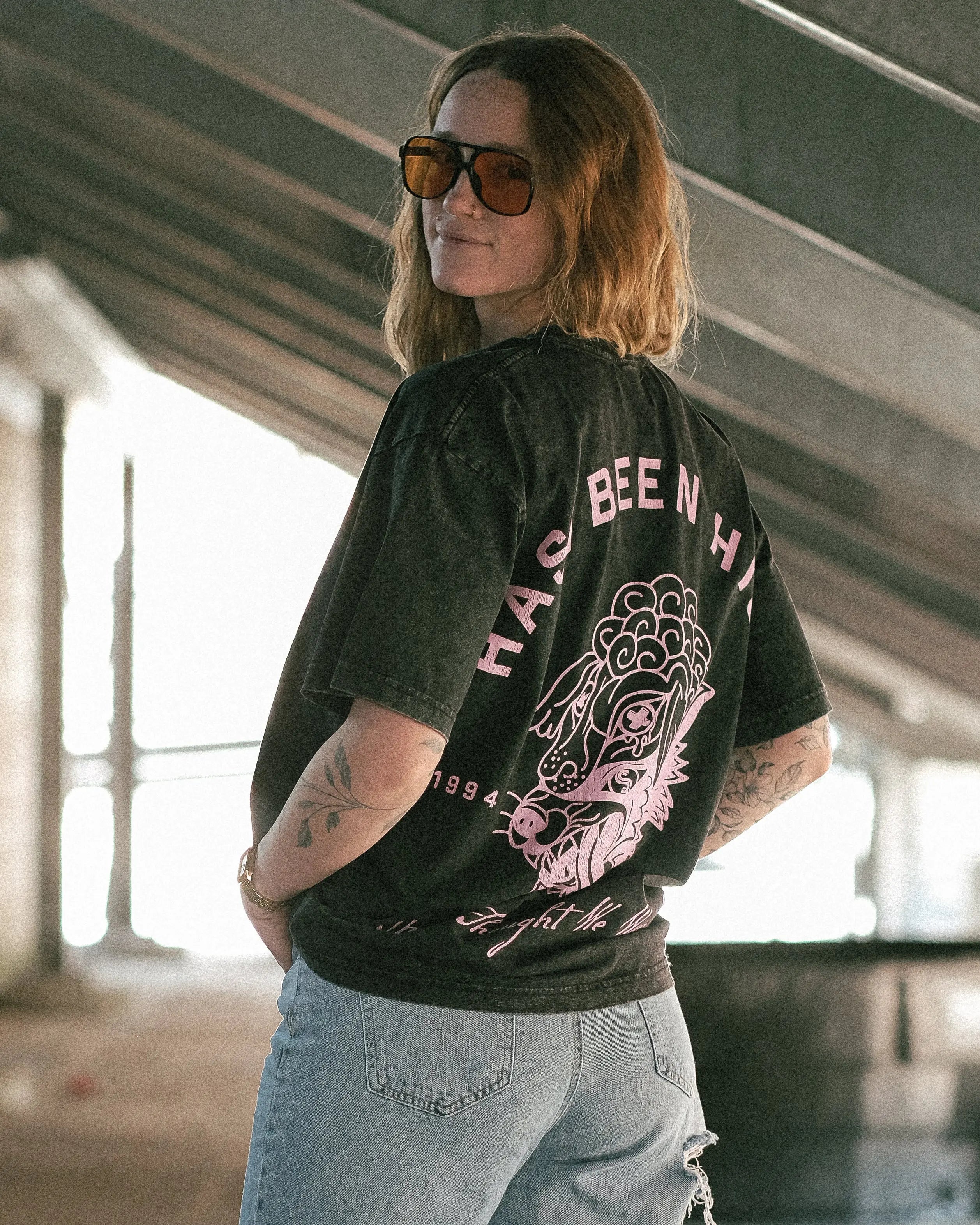 HAS/BEEN HIGH 1994 oversized graphic tee black vintage wash back print on model angled view streetwear outfit