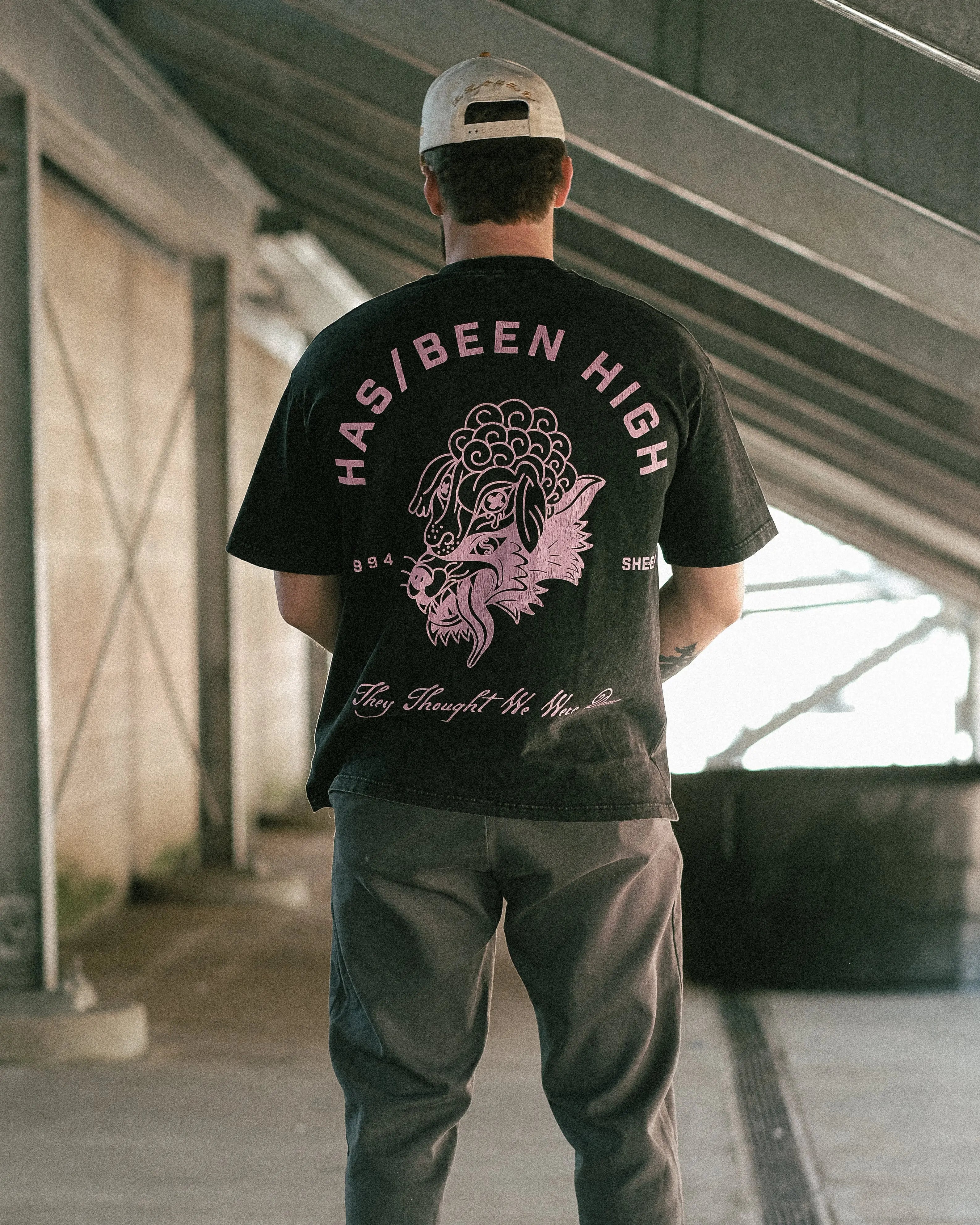HAS/BEEN HIGH 1994 oversized graphic tee black vintage wash on model back view full body streetwear outfit