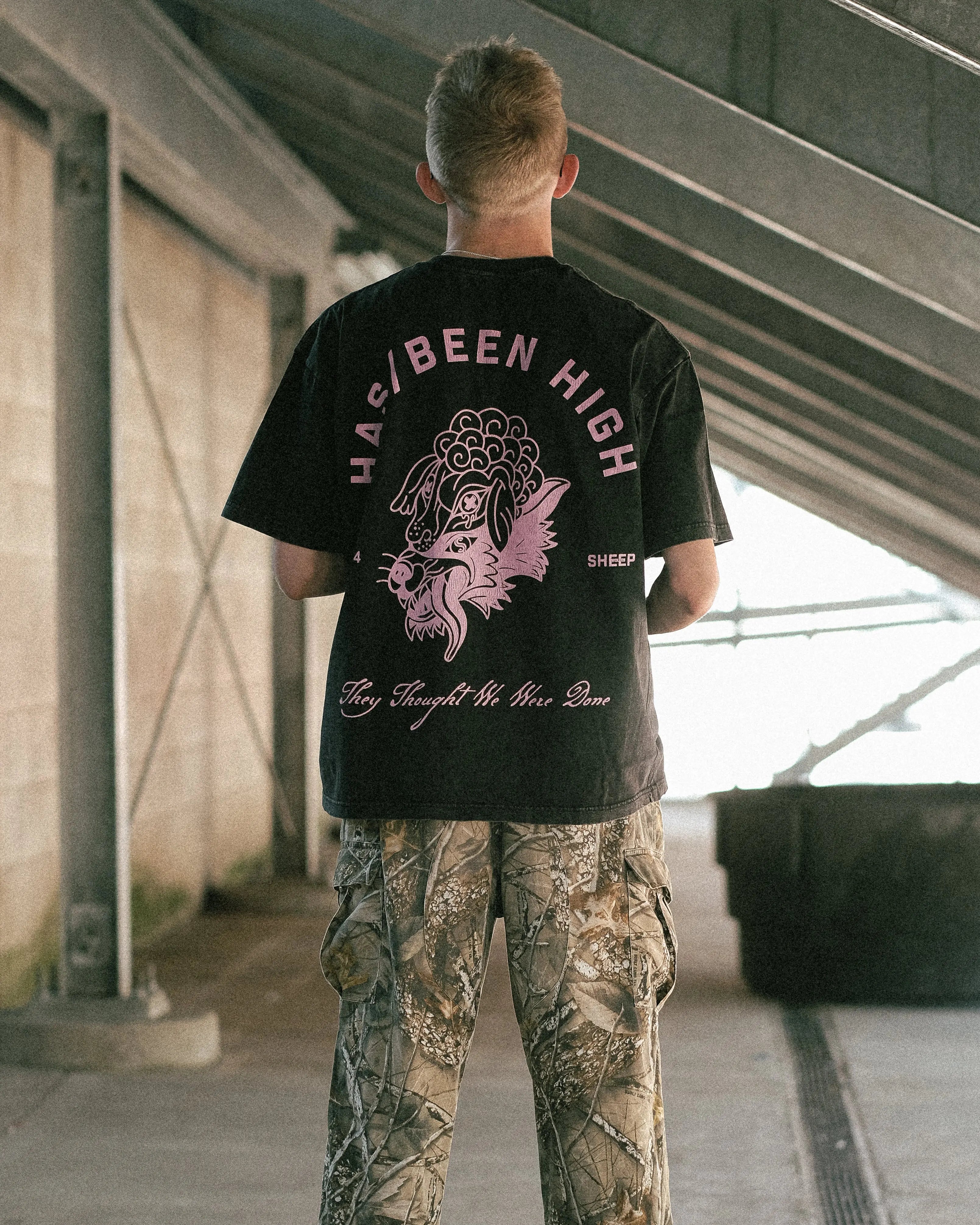 HAS/BEEN HIGH 1994 oversized graphic tee black vintage wash on model back view centered full body streetwear fit