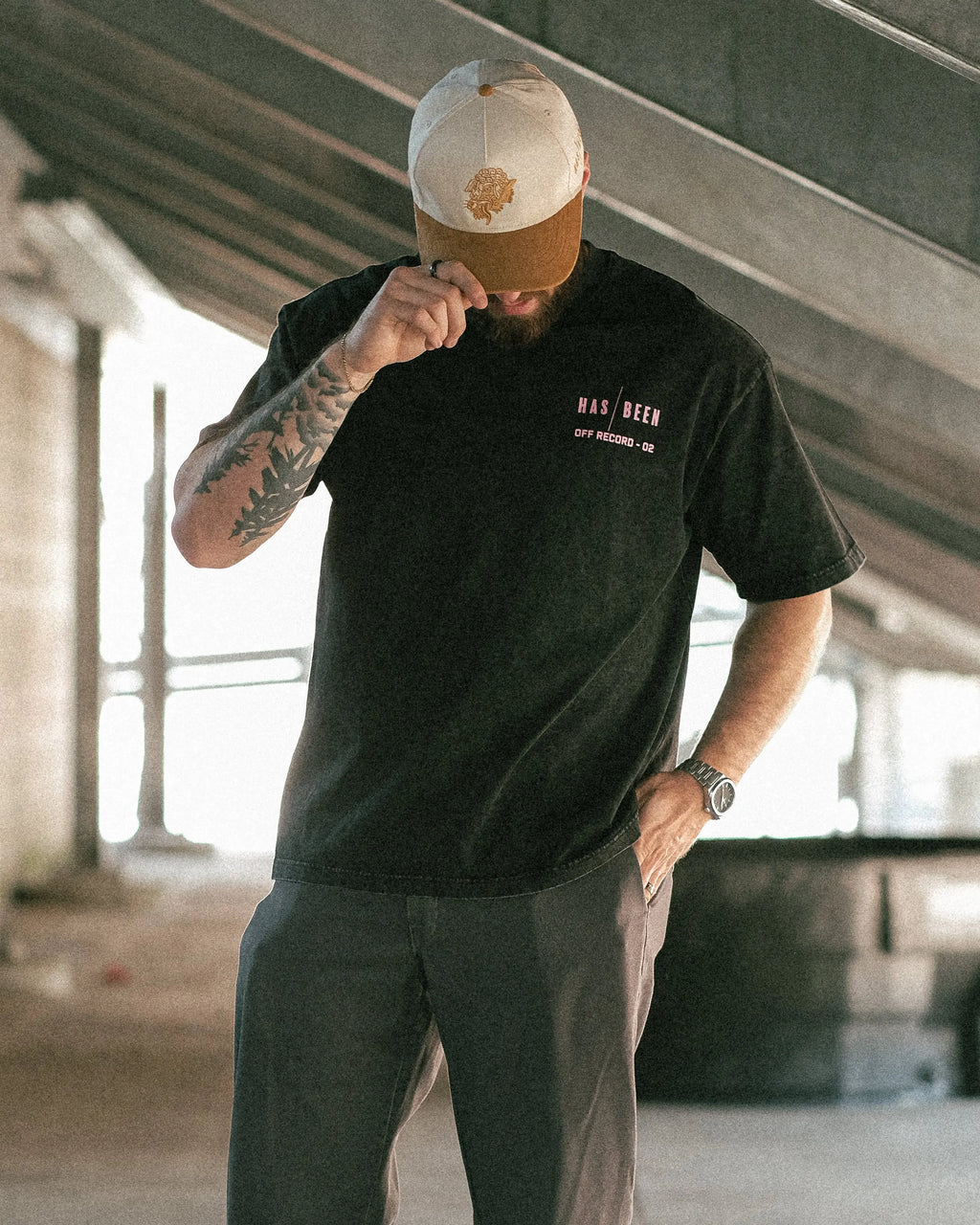 HAS/BEEN HIGH 1994 oversized tee black vintage wash from OFF THE RECORD collection on model front view head down streetwear outfit