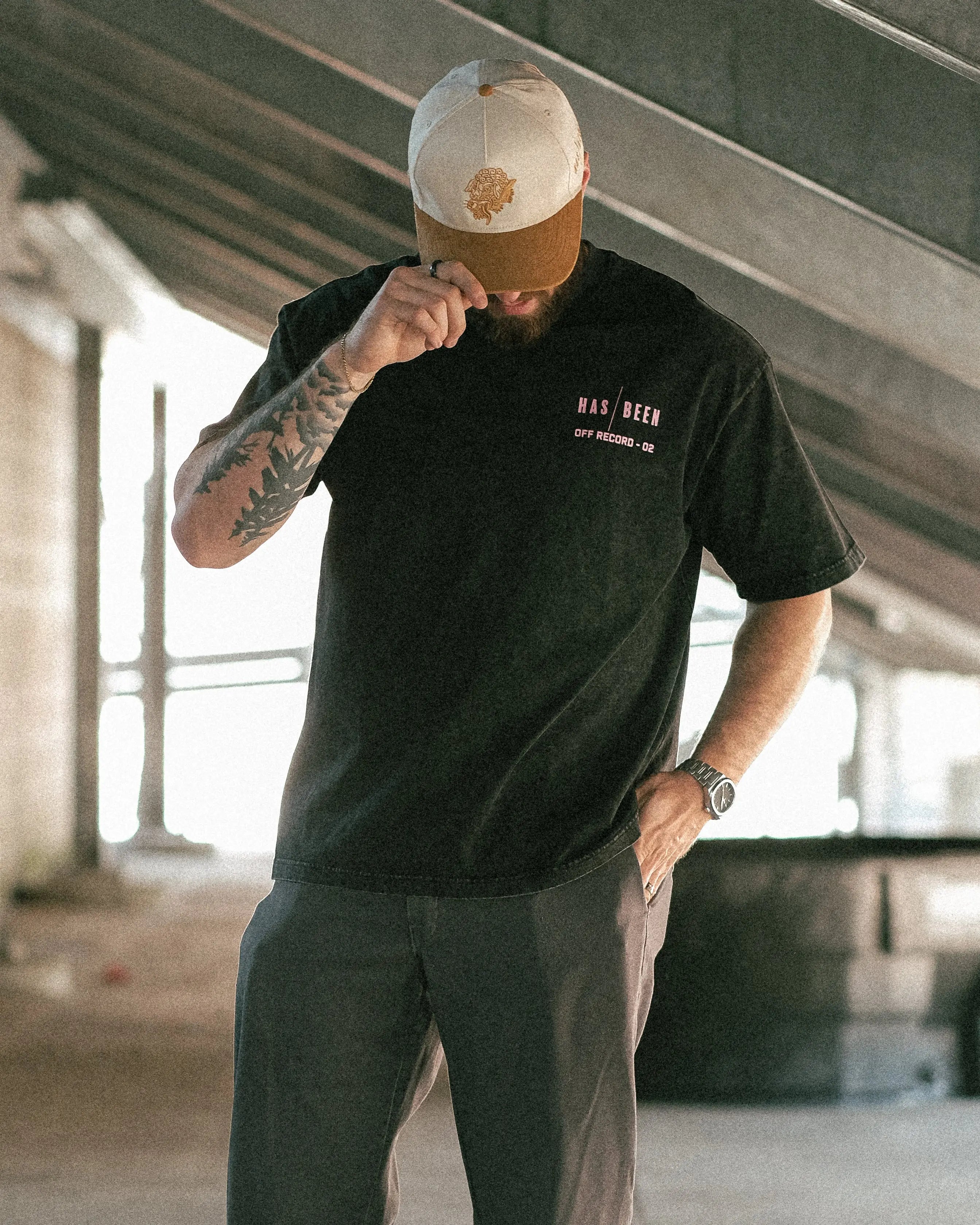 HAS/BEEN HIGH 1994 oversized tee black vintage wash from OFF THE RECORD collection on model front view head down streetwear outfit