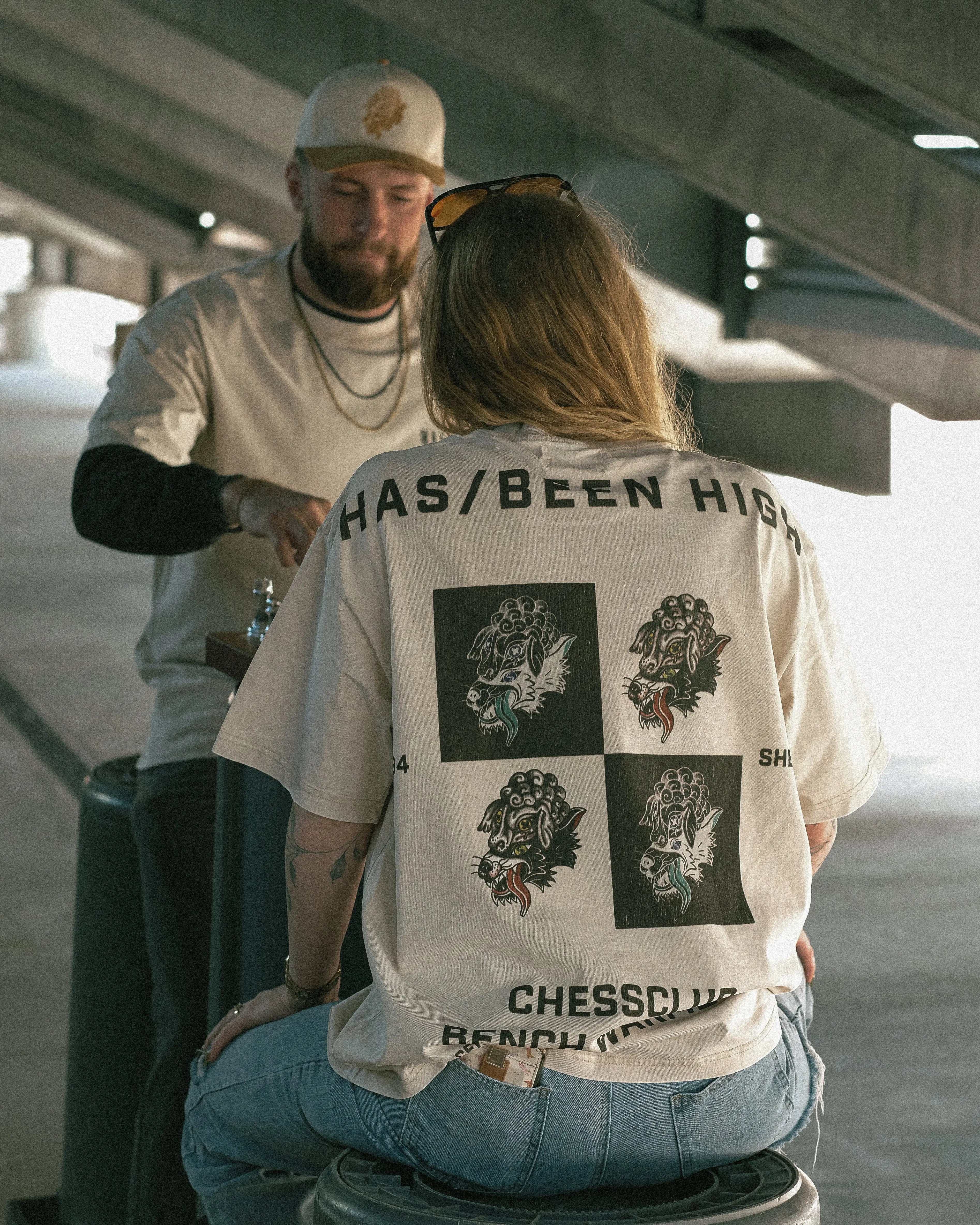 HAS/BEEN HIGH chess club oversized heavyweight tee back print on model playing chess lifestyle