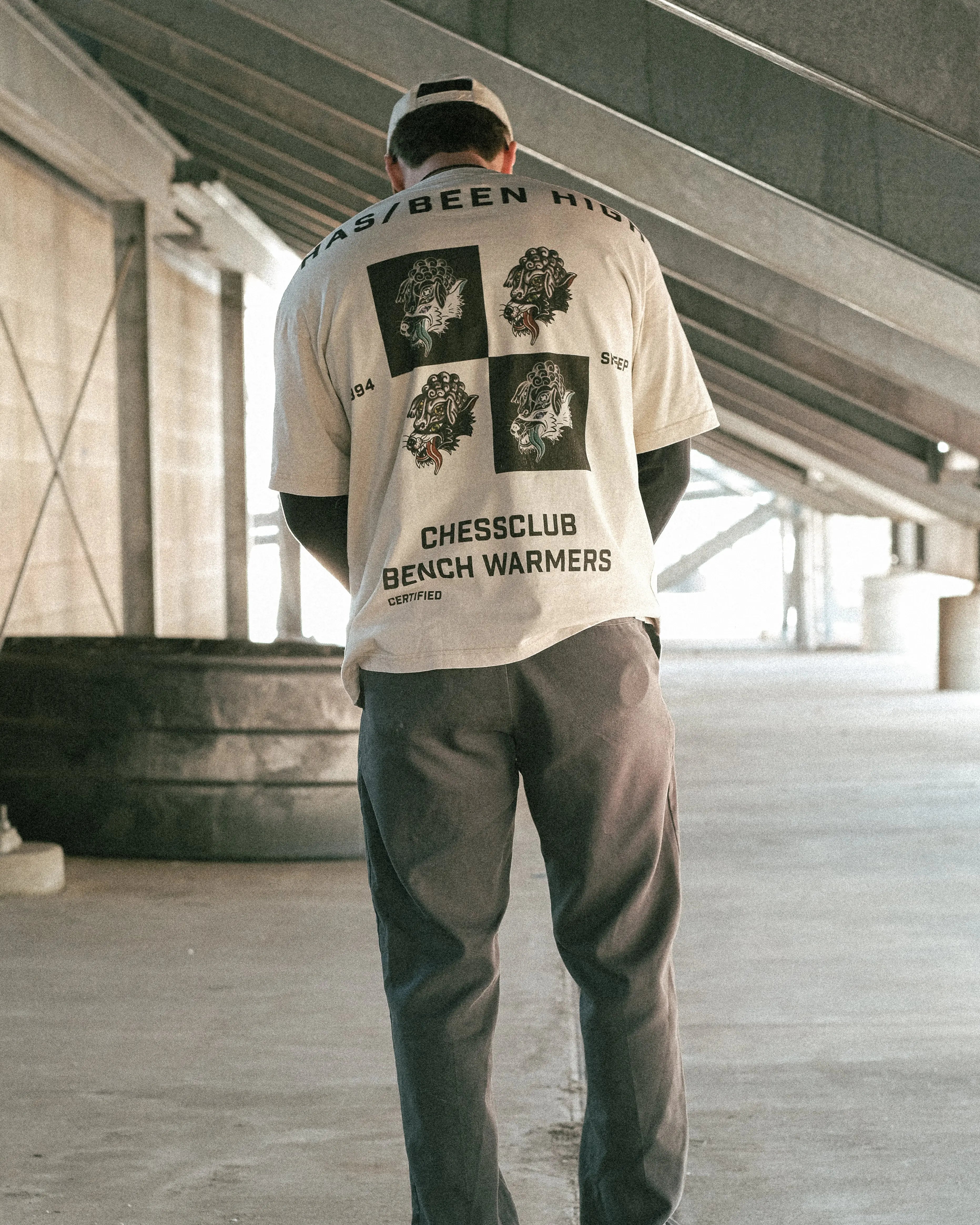 HAS/BEEN HIGH chess club oversized heavyweight tee beige back graphic on male model streetwear outfit