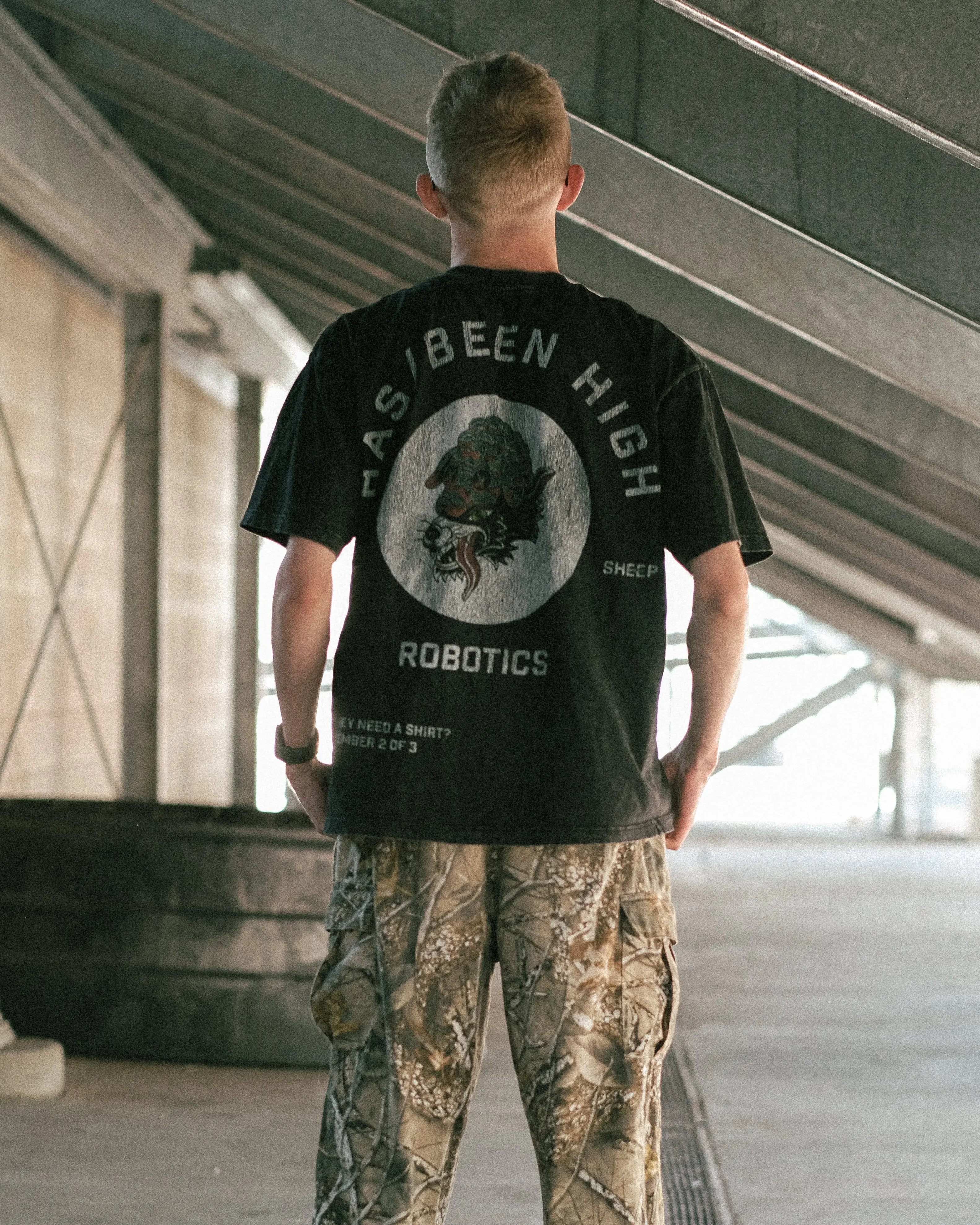 HAS/BEEN HIGH robotics club oversized heavyweight tee black vintage wash back view male model standing