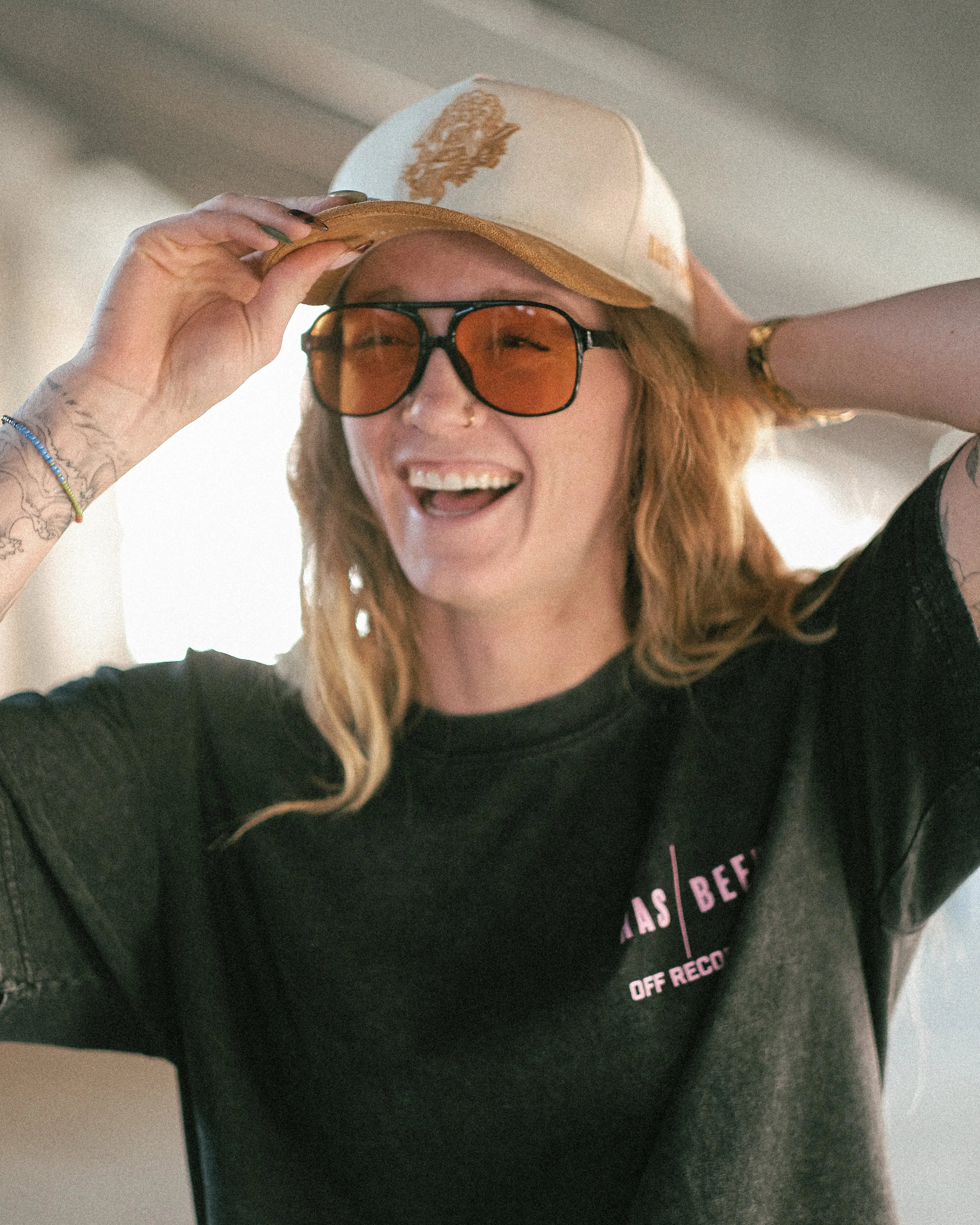 HAS/BEEN off record 5 panel cap ivory crown tan suede brim on model angled front view embroidered logo